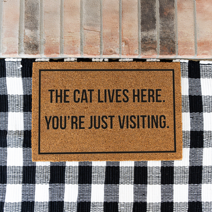 The Cat Lives Here You’re Just Visiting Doormat, Funny Cat Welcome Mat, Cat Lover Gift, Cat Owner Door Mat, Housewarming Front Door Decor