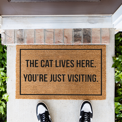 The Cat Lives Here You’re Just Visiting Doormat, Funny Cat Welcome Mat, Cat Lover Gift, Cat Owner Door Mat, Housewarming Front Door Decor
