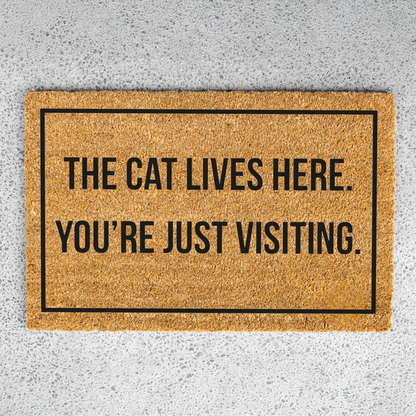 The Cat Lives Here You’re Just Visiting Doormat, Funny Cat Welcome Mat, Cat Lover Gift, Cat Owner Door Mat, Housewarming Front Door Decor